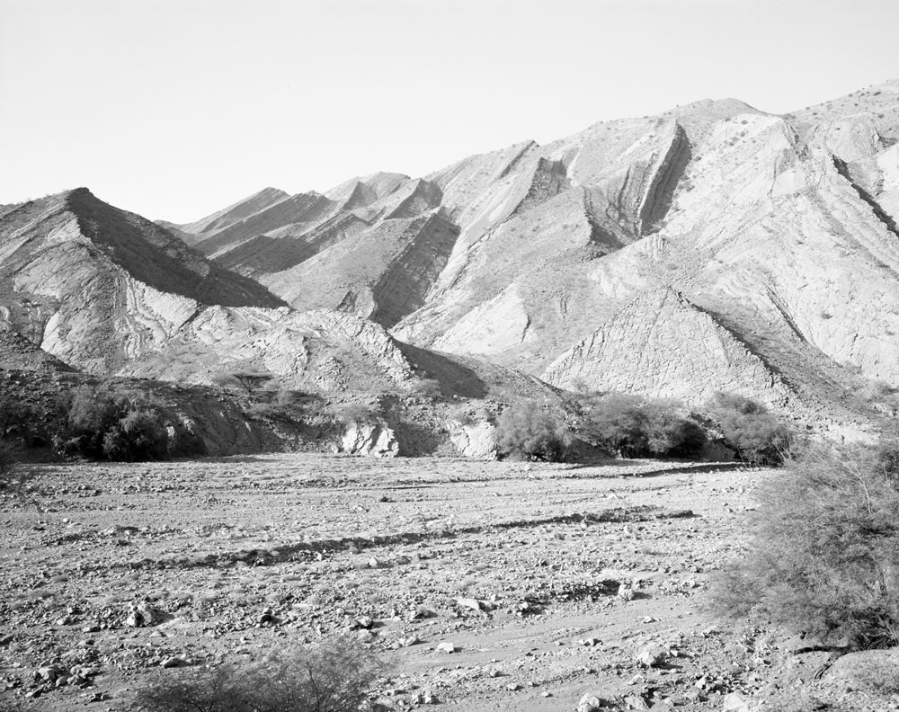 Winfried Bullinger - Mountains in the north of the Danakil Depression in Ethiopia with a dry river bed